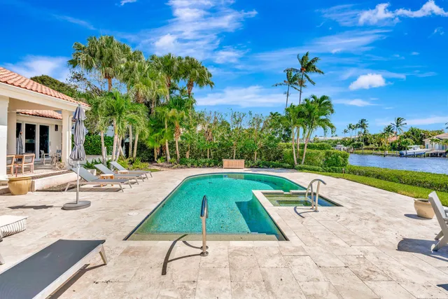 a view of a swimming pool with chairs