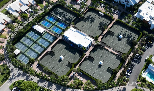 a living room with furniture and floor to ceiling window