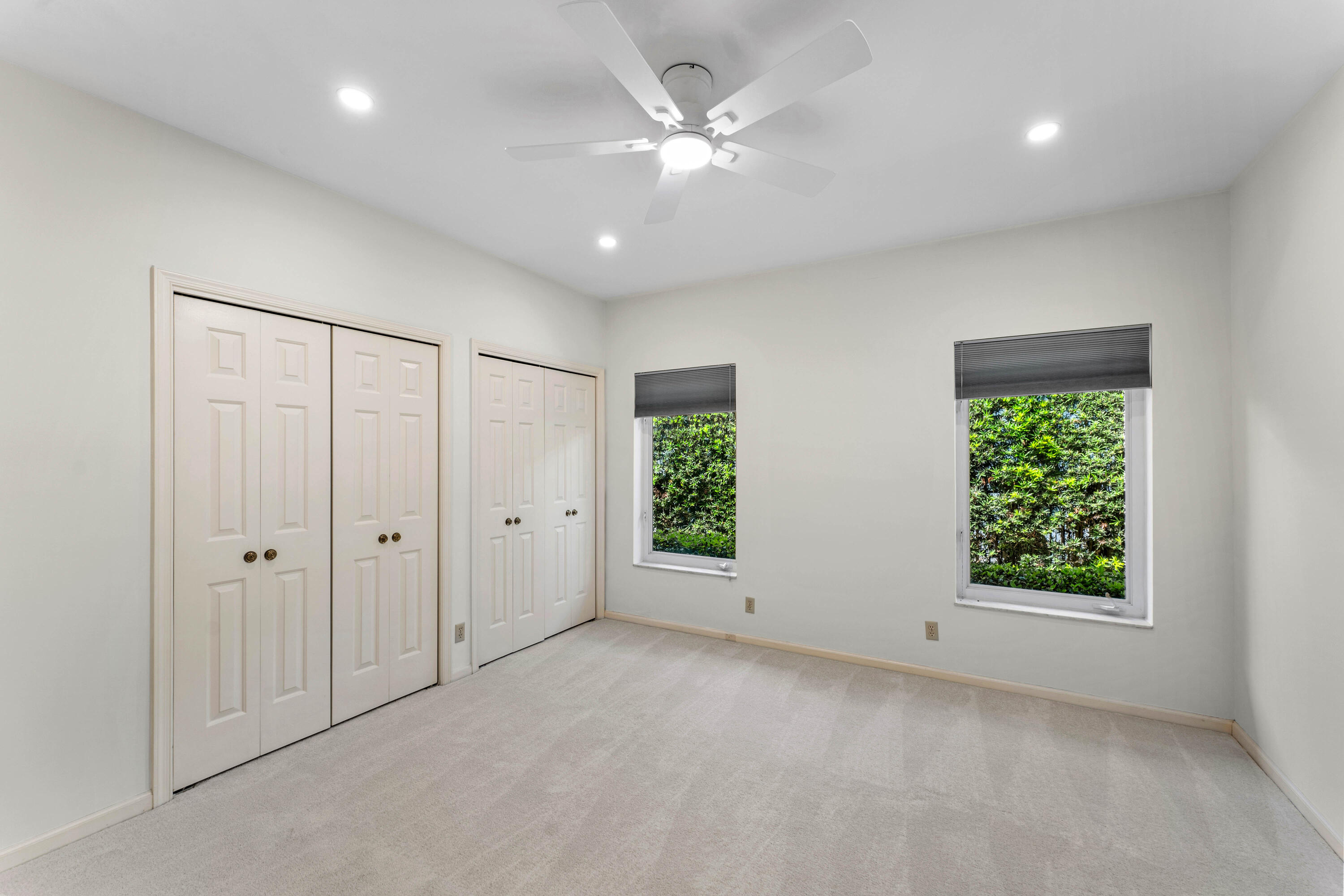 1851 Thatch Palm Drive Boca Raton, FL 33432 - Photo 33 of 70 an empty room with windows and closet