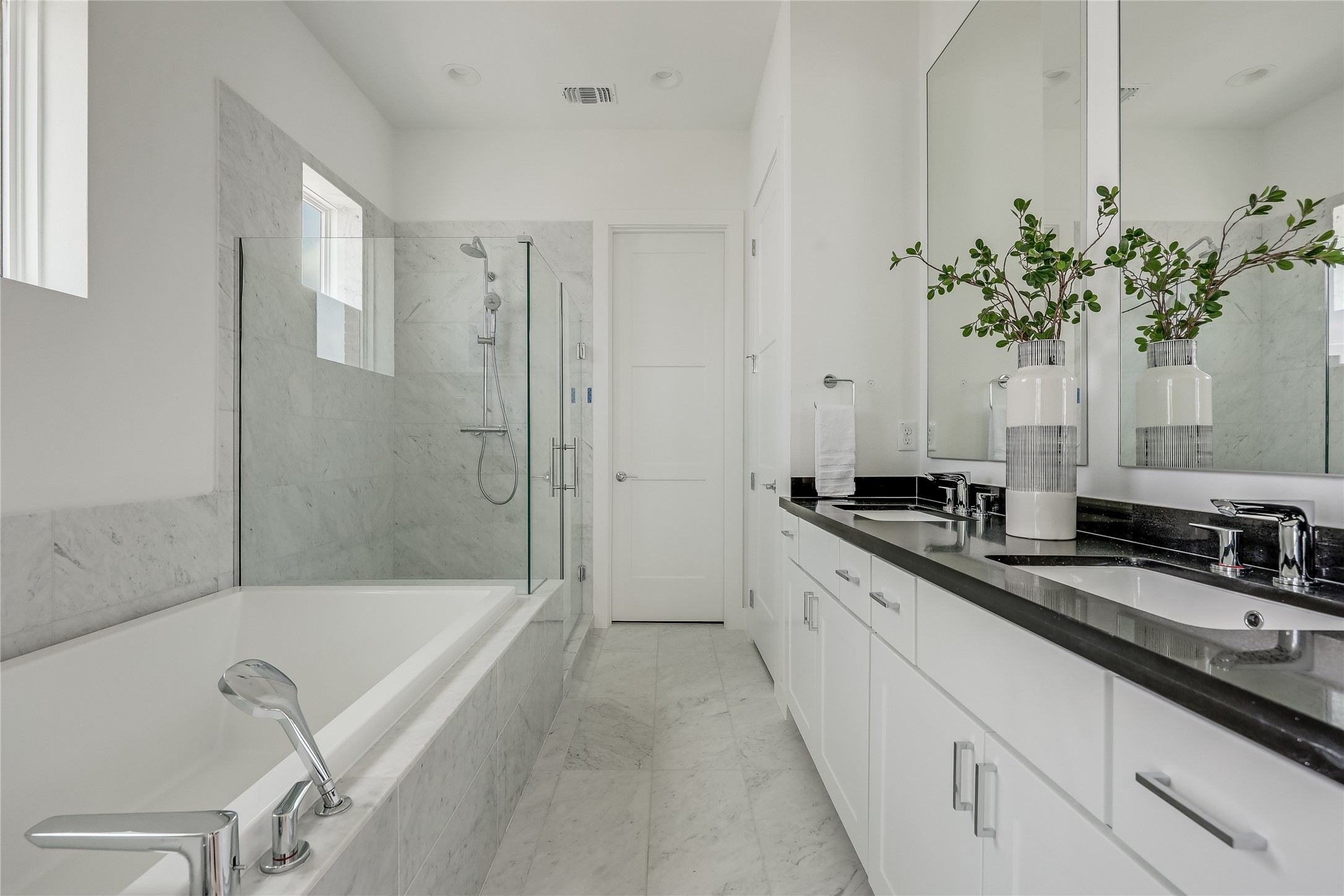 2805 McCurdy Street, Unit 19 Austin, TX 78723 - Photo 17 of 39 a spacious bathroom with a granite countertop tub sink and mirror