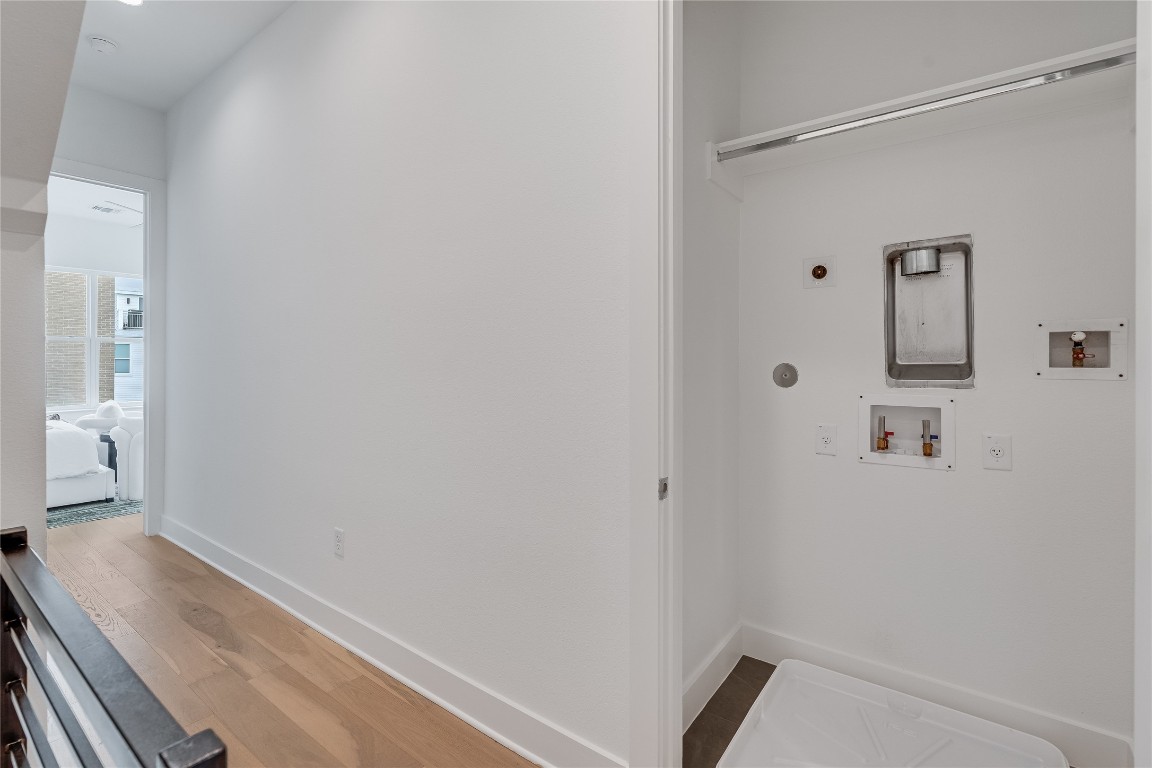 2805 McCurdy Street, Unit 19 Austin, TX 78723 - Photo 22 of 39 The in home laundry closet is conveniently located upstairs between the primary and secondary bedrooms.