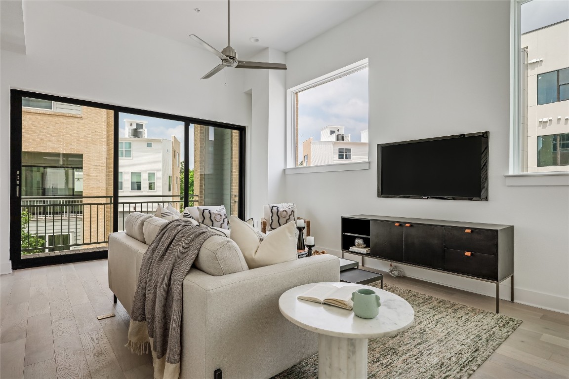 2805 McCurdy Street, Unit 19 Austin, TX 78723 - Photo 6 of 39 The main floor is wrapped in oversized windows that infuse the space in peaceful natural light.