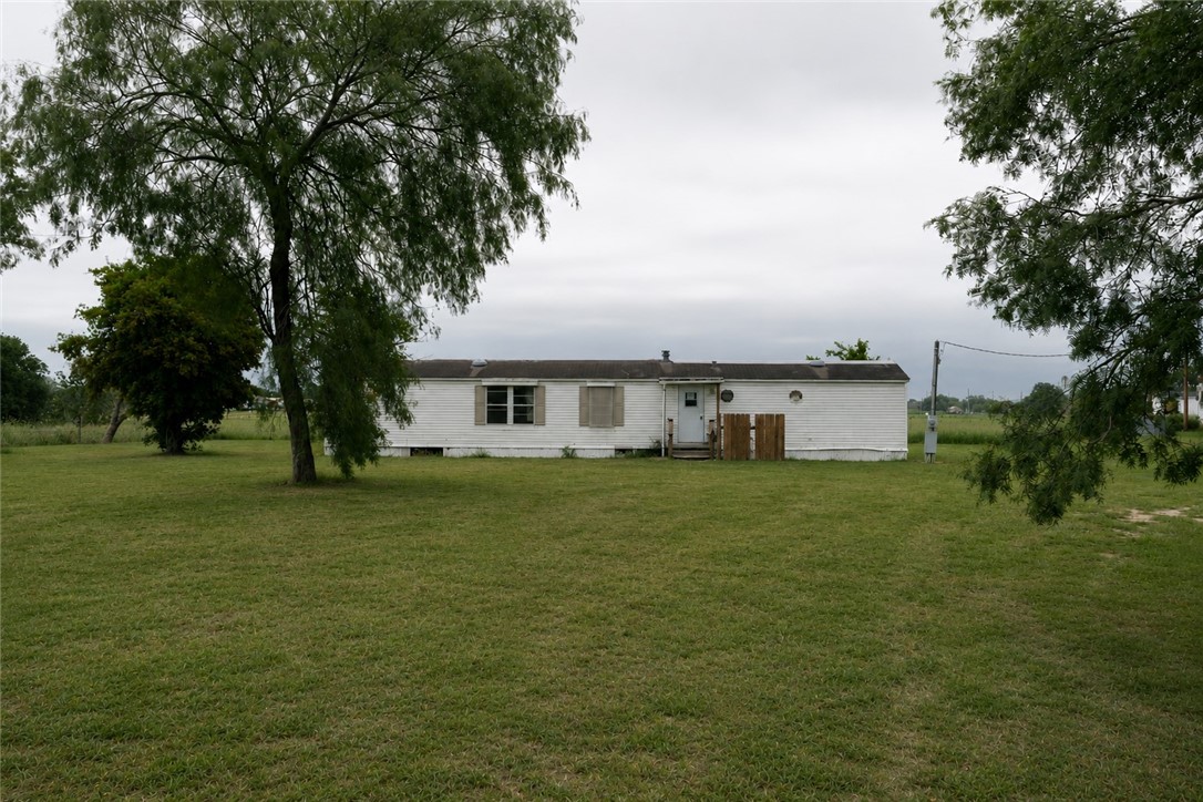 240 Ranger Drive Sandia, TX 78383 - Photo 1 of 12 a front view of a house with a garden