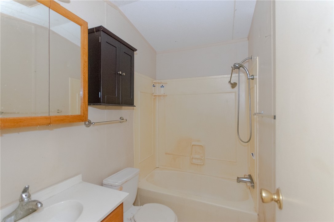 240 Ranger Drive Sandia, TX 78383 - Photo 11 of 12 a bathroom with a shower curtain and a sink
