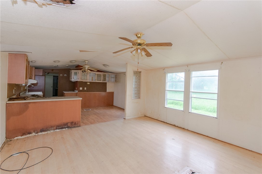 240 Ranger Drive Sandia, TX 78383 - Photo 2 of 12 an empty room with windows and ceiling fan