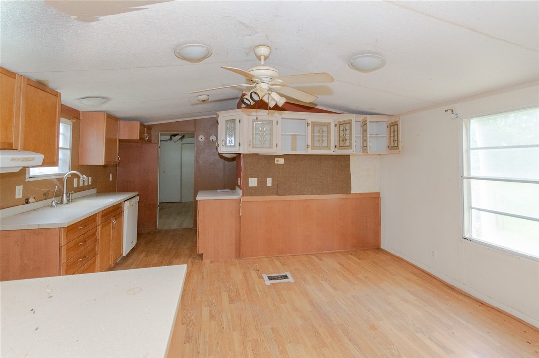 240 Ranger Drive Sandia, TX 78383 - Photo 3 of 12 a living room with stainless steel appliances kitchen island granite countertop a sink a stove top oven a counter space and cabinets