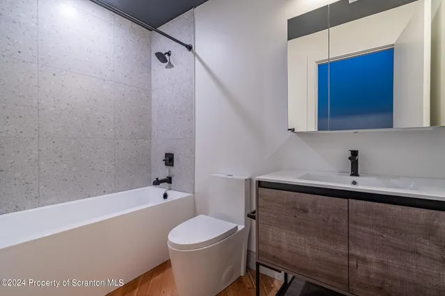 a kitchen with stainless steel appliances granite countertop a refrigerator a stove top oven a sink and dishwasher