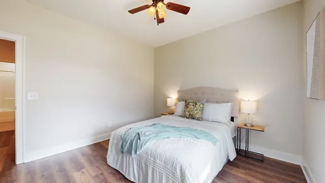 a view of a workspace with a couch and a potted plant