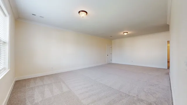 a bathroom with a granite countertop sink toilet a mirror and shower