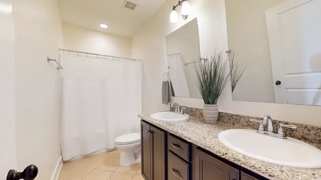 a view of a house with a yard and patio