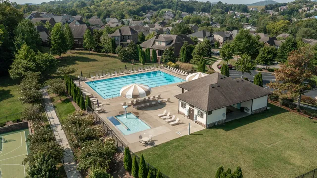 a view of a wooden deck with lake view