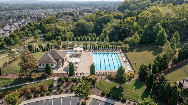 an aerial view of a house with a ocean view