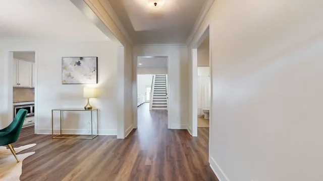 a kitchen with stove and white cabinets