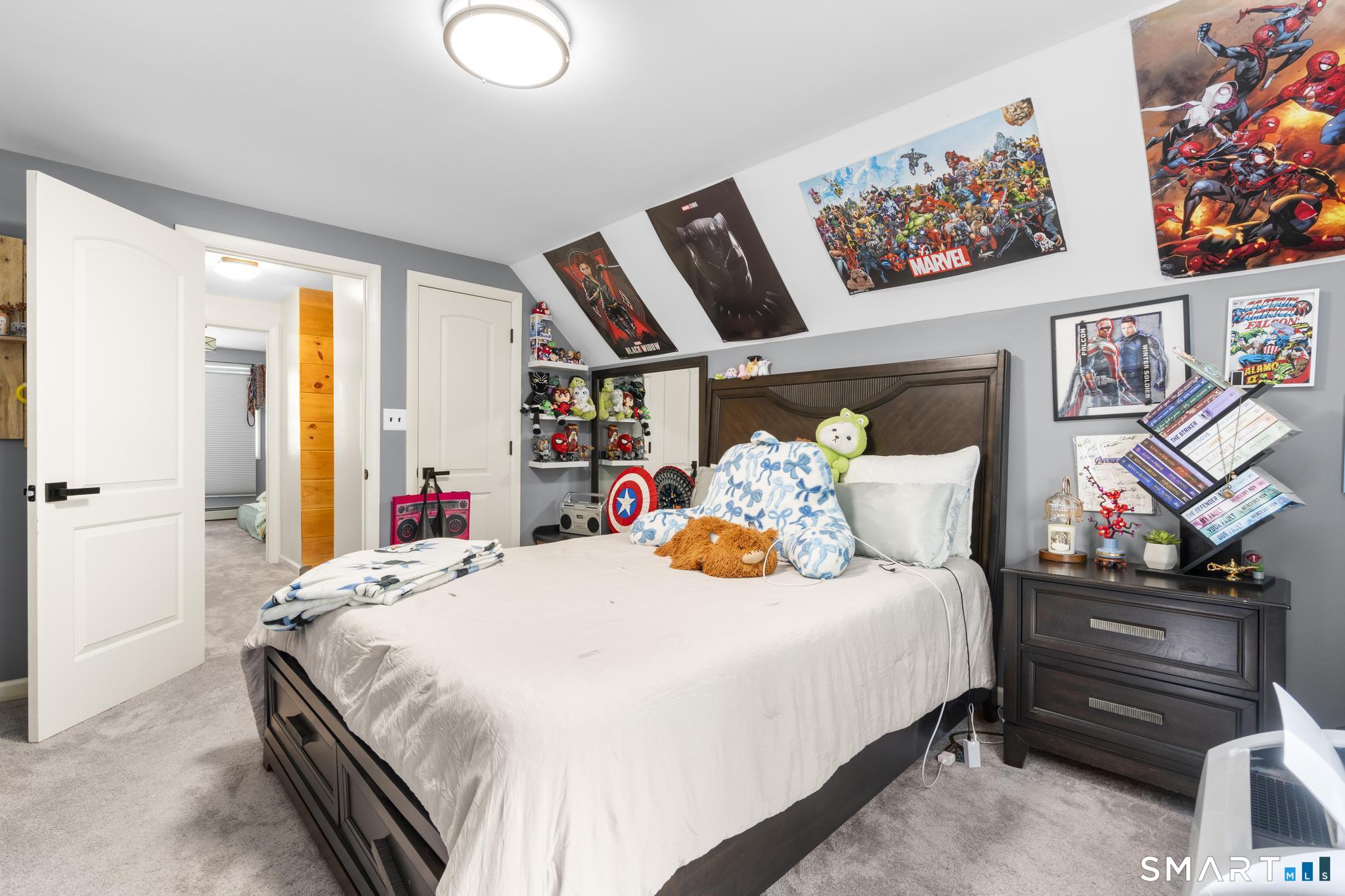 13 Christy Hill Road Ledyard, CT 06335 - Photo 25 of 38 a bedroom with a bed and wooden floor