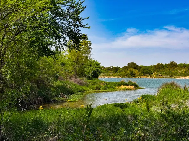 a view of lake with green space