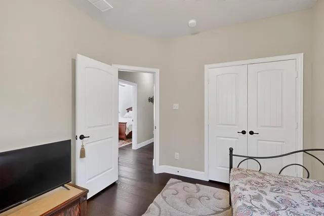 wooden floor in a hall with an entryway and a workspace