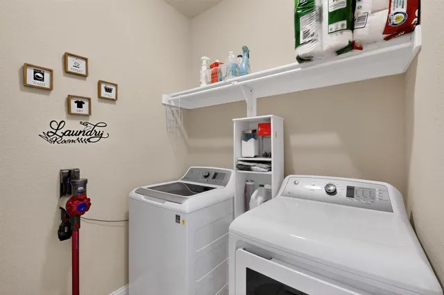 a utility room with dryer and washer