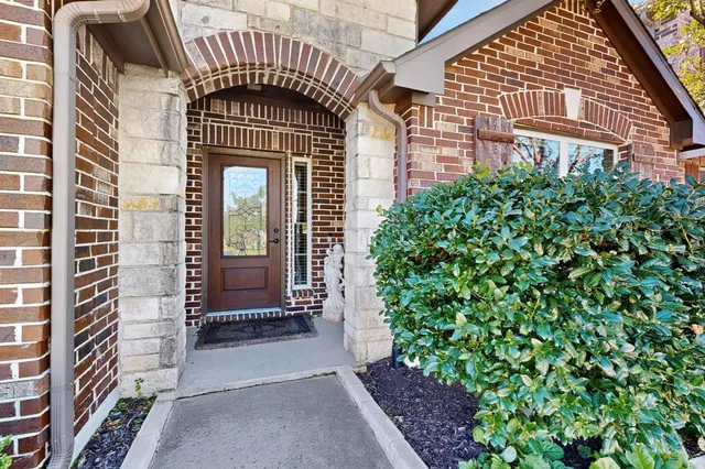 an entrance to house with yard
