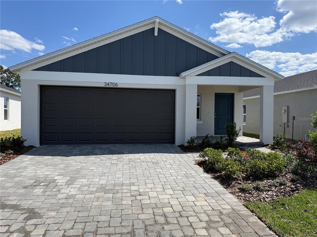 34706 Blossom Fall Path Dade City, FL 33525 - Photo 1 of 27 a front view of a house