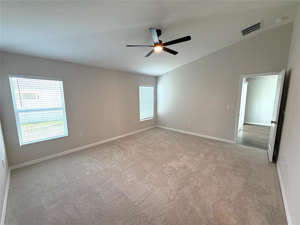 34706 Blossom Fall Path Dade City, FL 33525 - Photo 15 of 27 a view of an empty room with a window