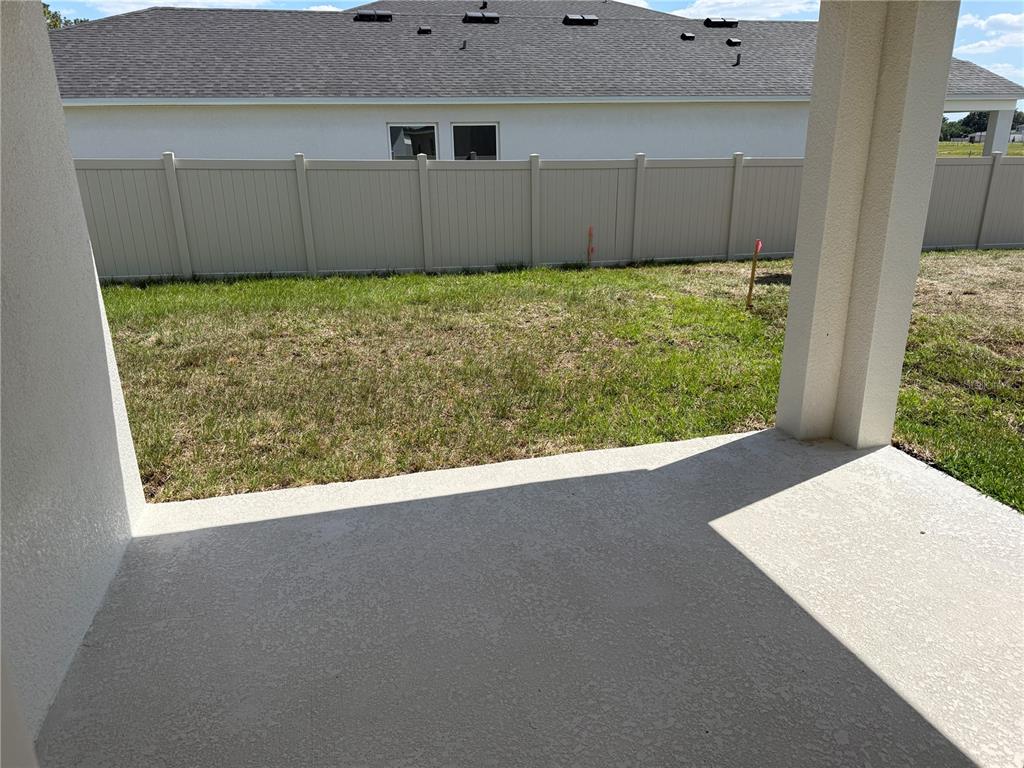 34706 Blossom Fall Path Dade City, FL 33525 - Photo 21 of 27 a view of a backyard