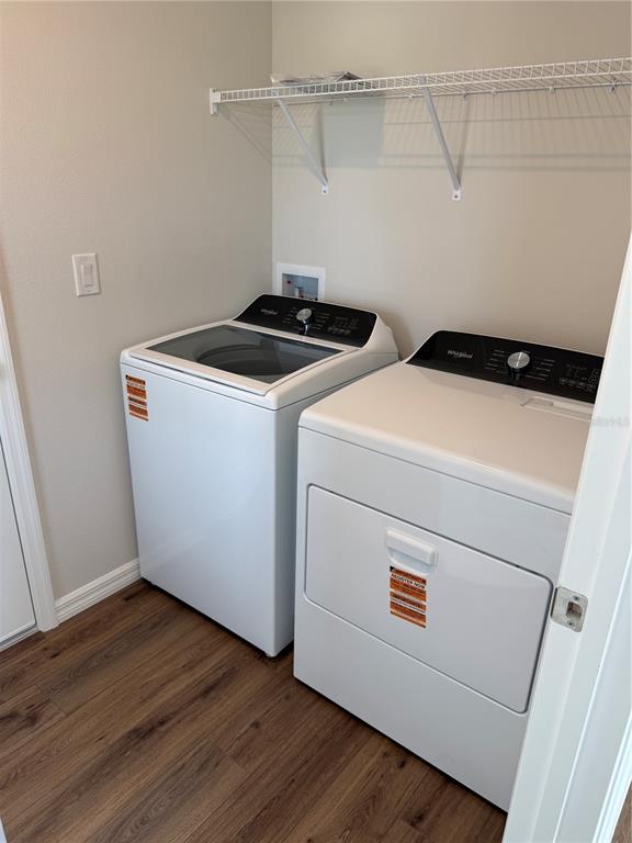 34706 Blossom Fall Path Dade City, FL 33525 - Photo 3 of 27 a utility room with dryer and washer