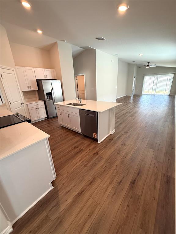 34706 Blossom Fall Path Dade City, FL 33525 - Photo 4 of 27 a large room with wooden floor