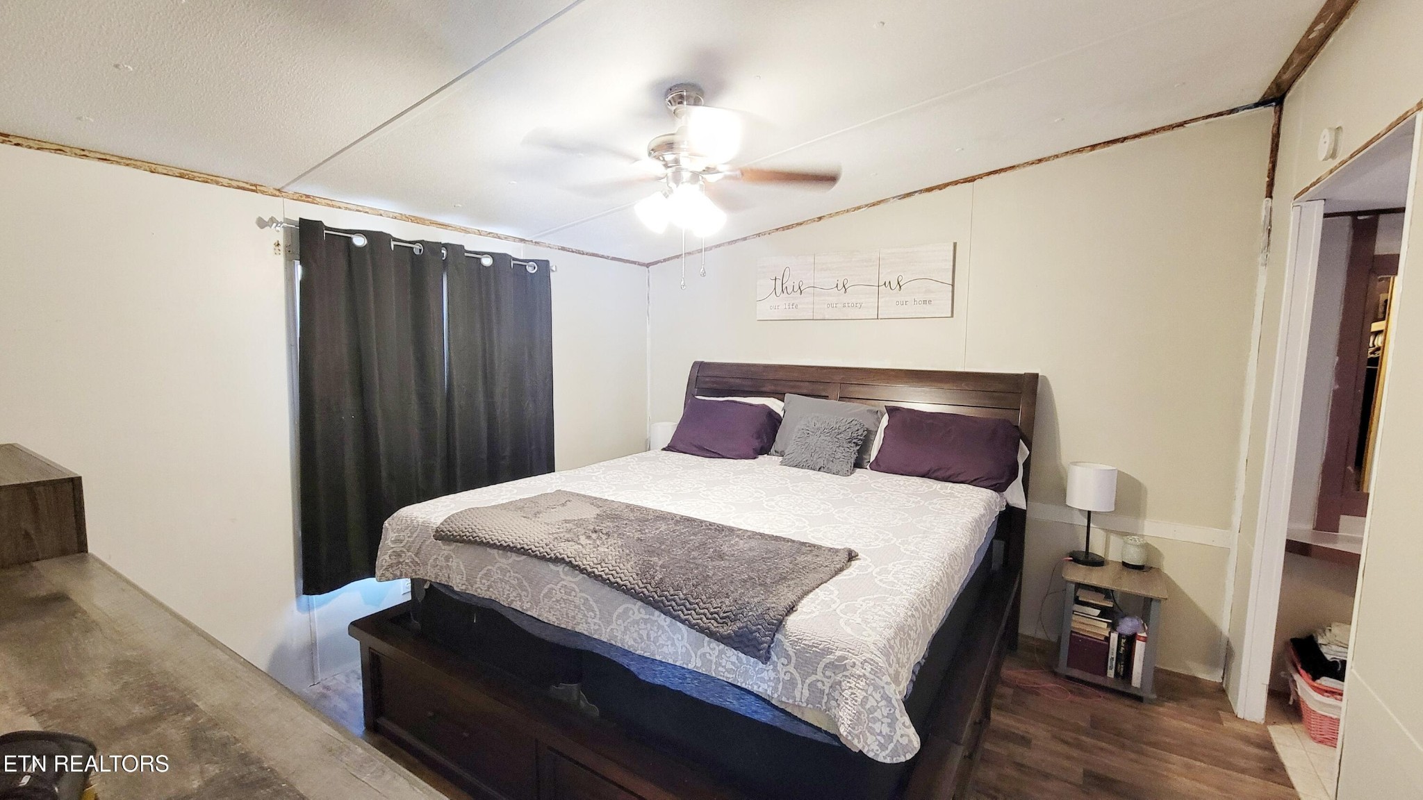 1290 Bluets Road Newport, TN 37821 - Photo 20 of 34 a bedroom with a bed and wooden floor