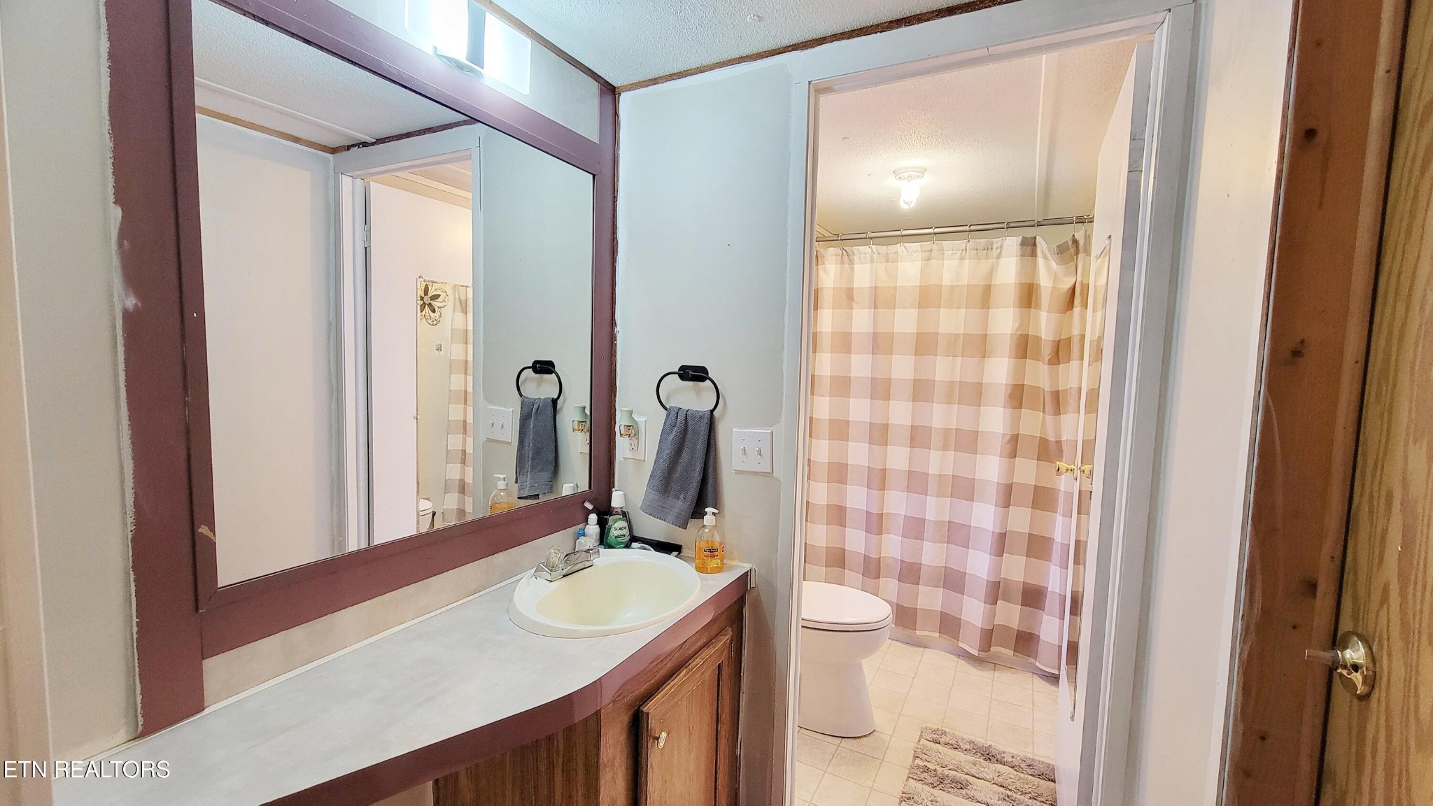 1290 Bluets Road Newport, TN 37821 - Photo 21 of 34 a bathroom with a sink a toilet and shower