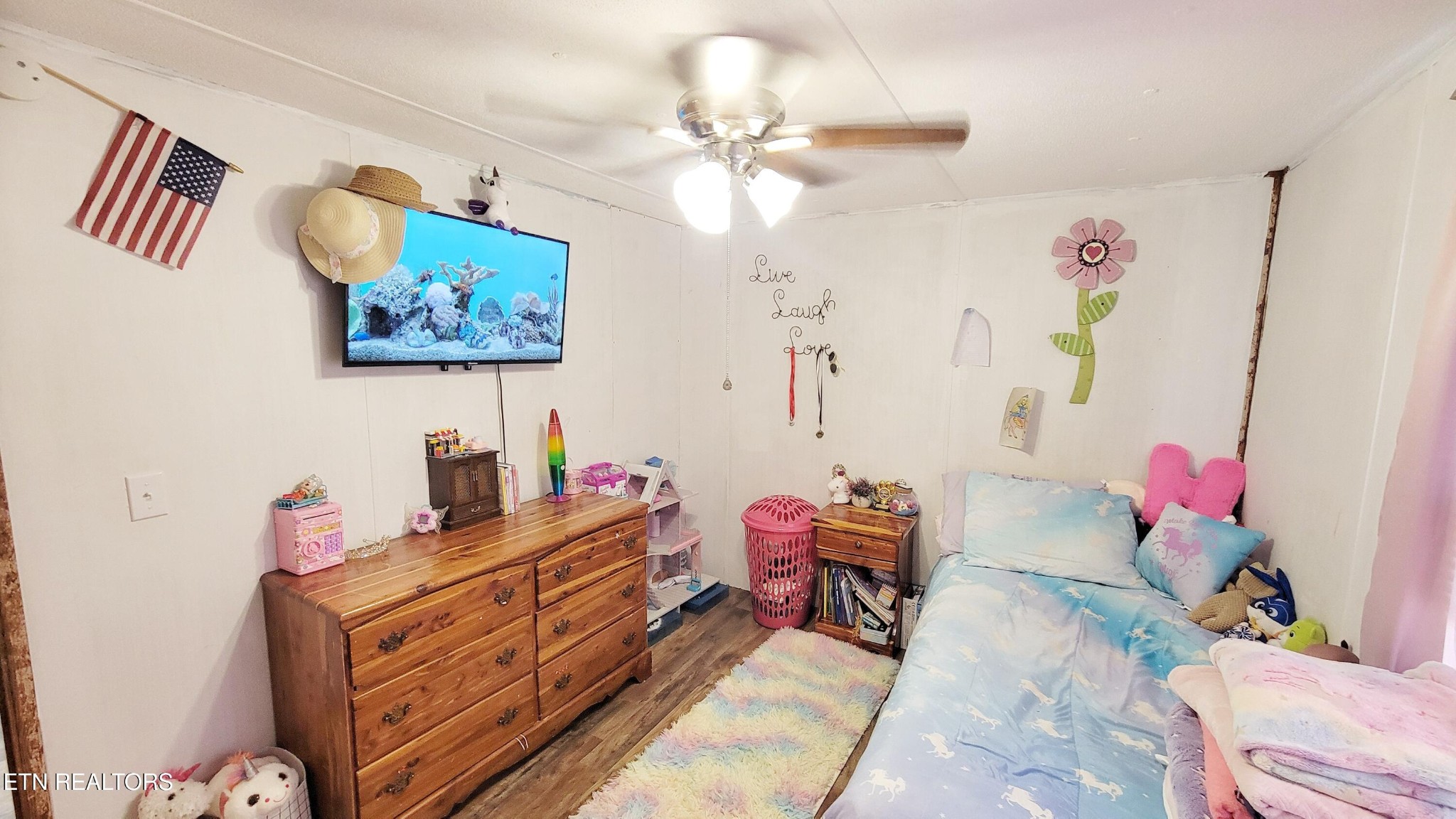 1290 Bluets Road Newport, TN 37821 - Photo 25 of 34 a bed room with a bed and a chandelier