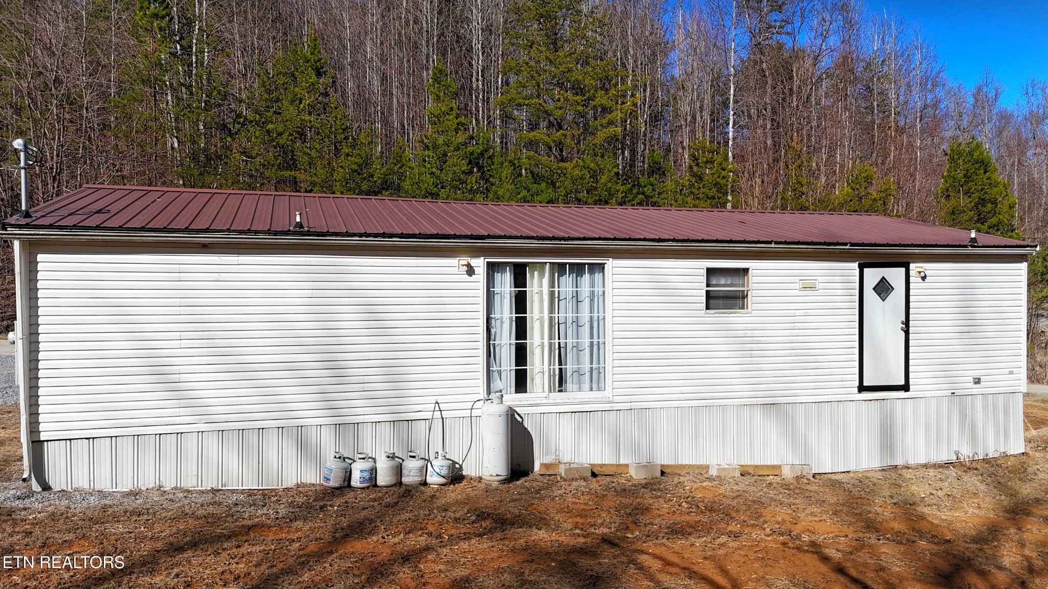 1290 Bluets Road Newport, TN 37821 - Photo 27 of 34 a front view of a house with a garden