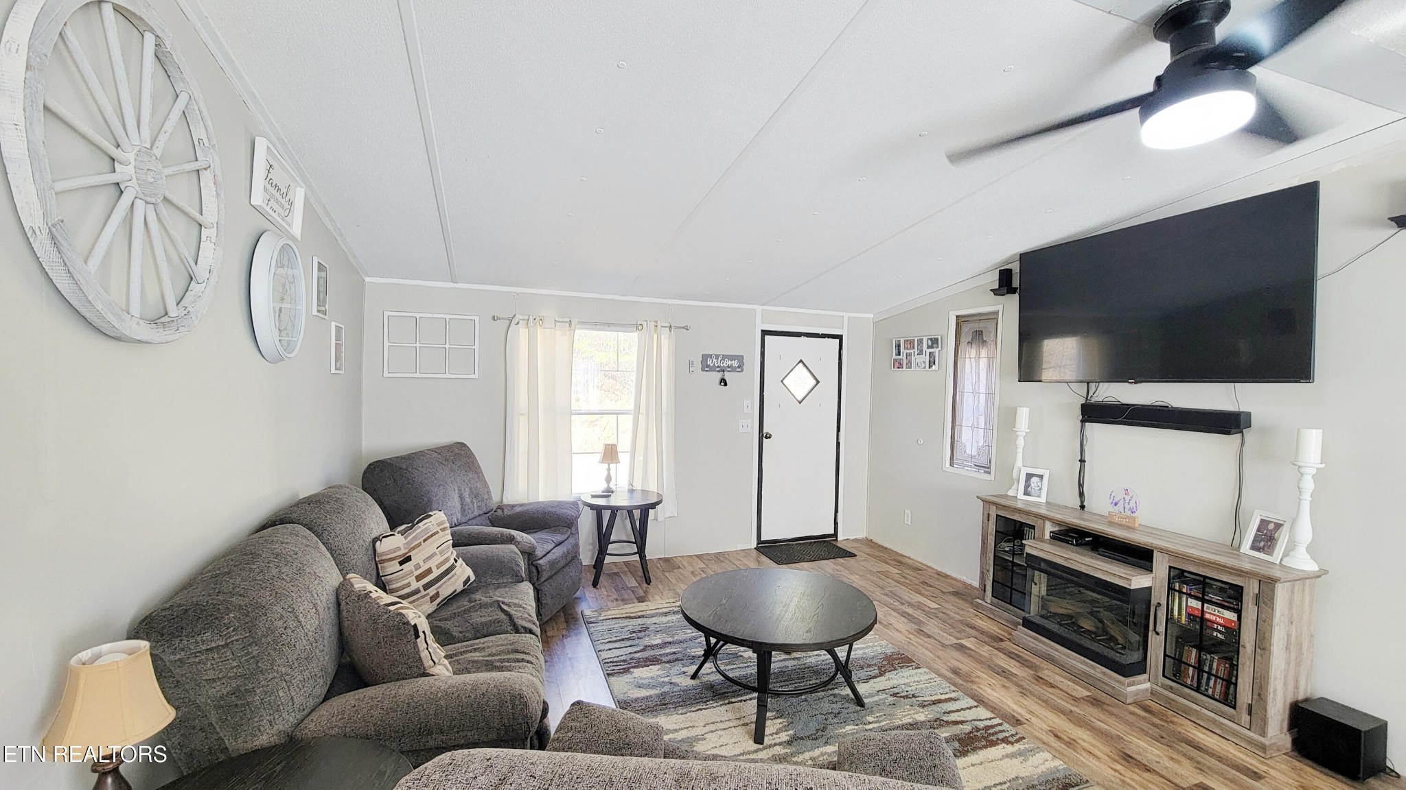 1290 Bluets Road Newport, TN 37821 - Photo 8 of 34 a living room with furniture a flat screen tv and a window