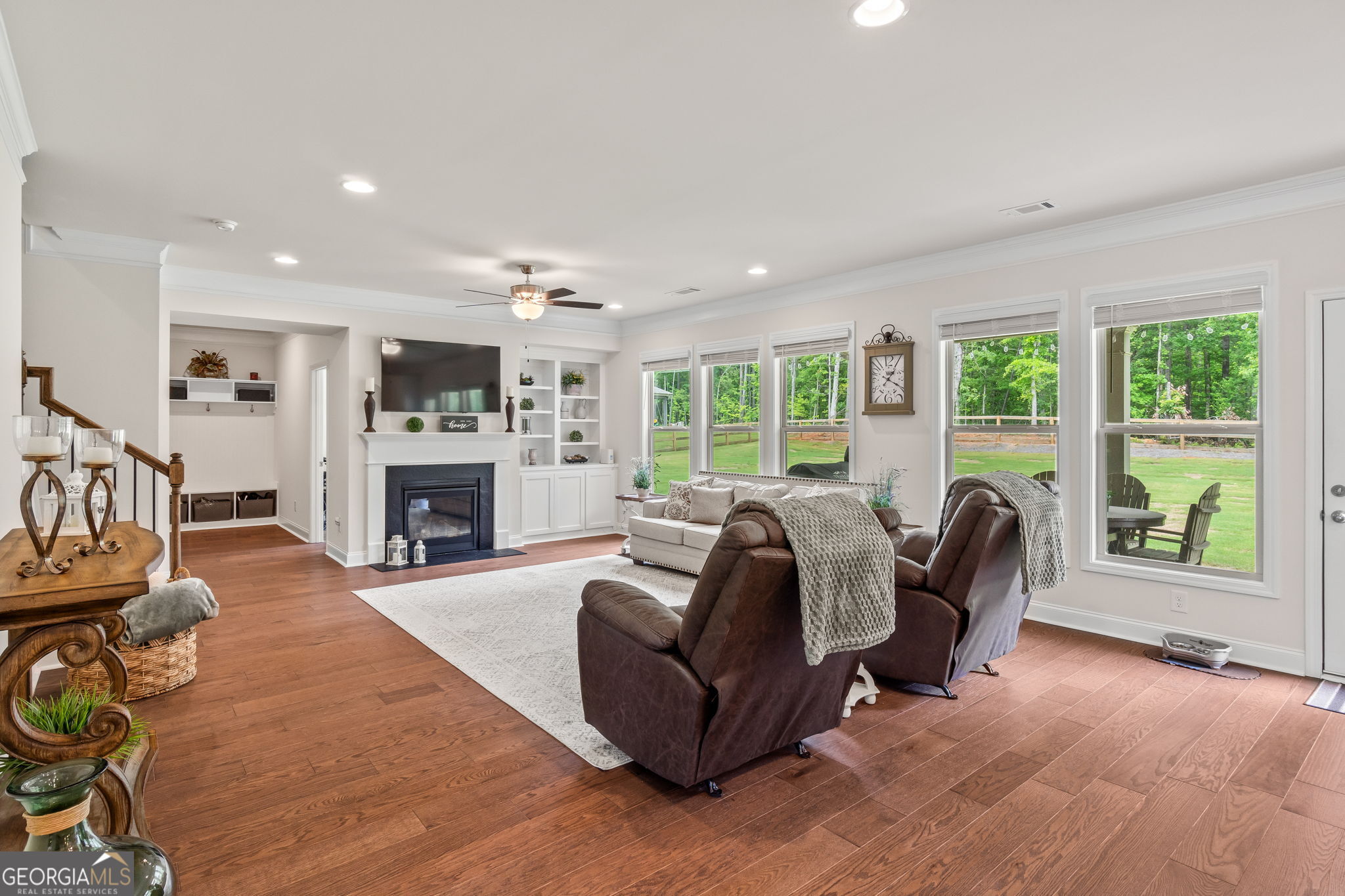 2884 Porches Lane Dacula, GA 30019 - Photo 16 of 41 a living room with fireplace furniture and a wooden floor