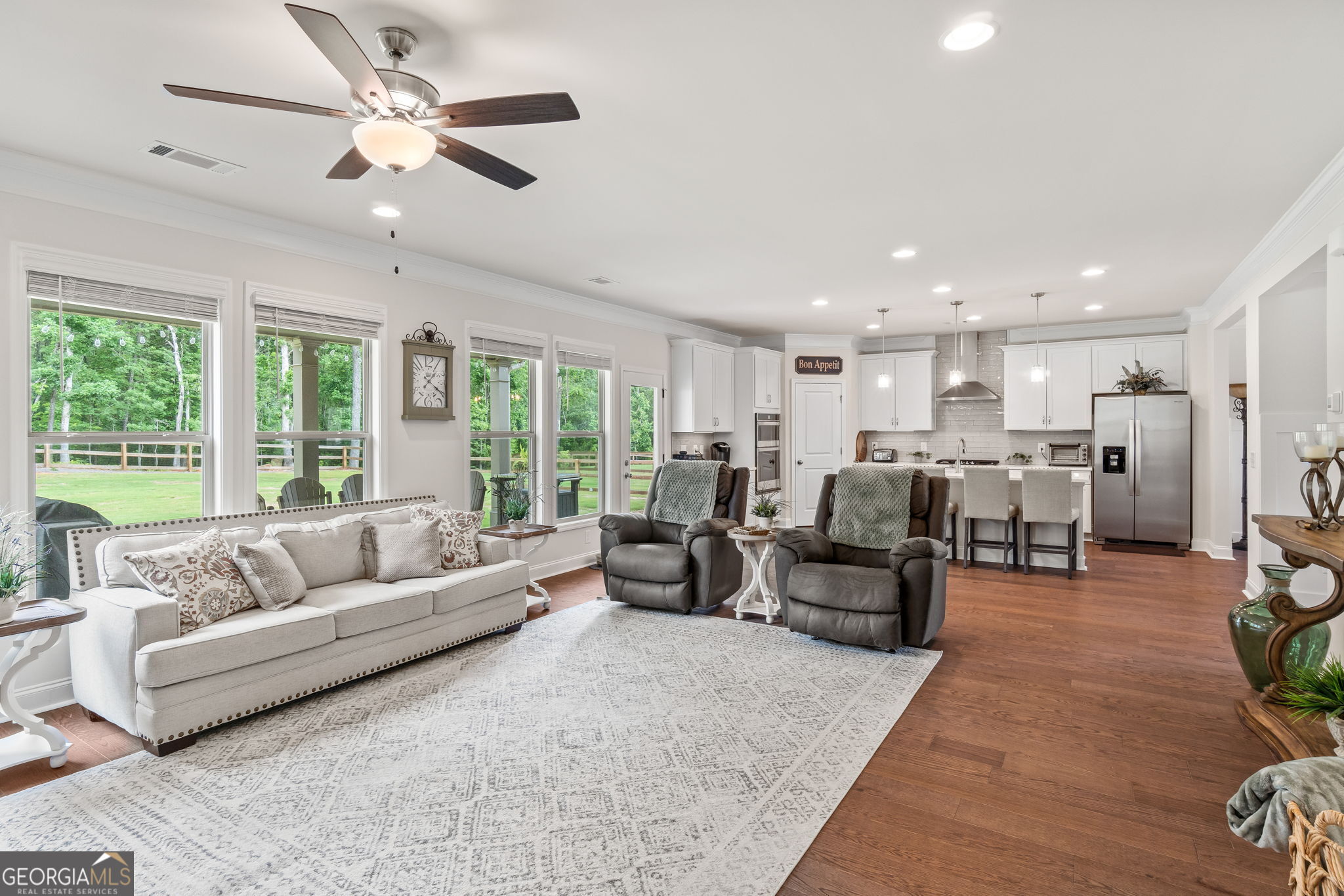 2884 Porches Lane Dacula, GA 30019 - Photo 17 of 41 a living room with furniture kitchen area and a large window