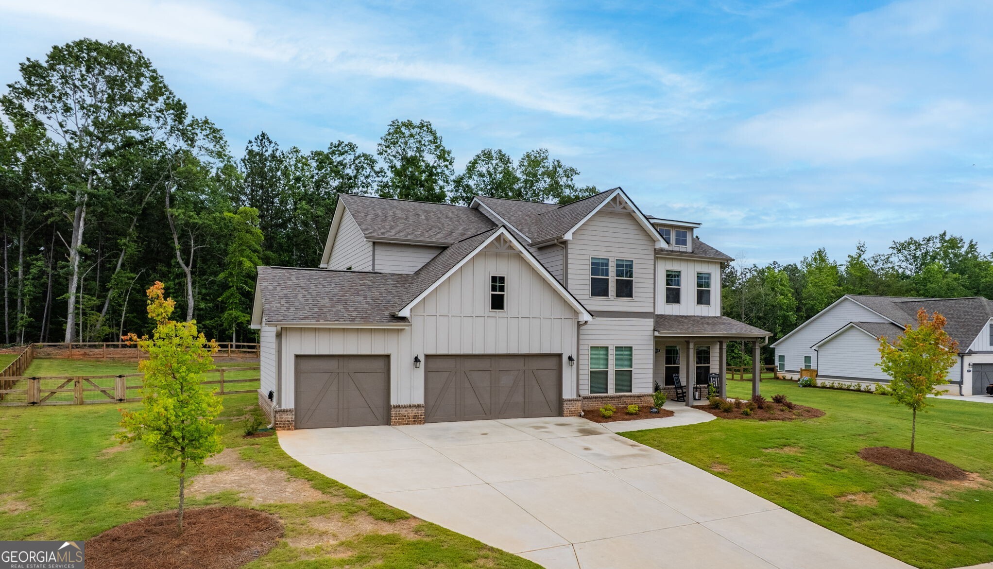 2884 Porches Lane Dacula, GA 30019 - Photo 2 of 41 a front view of house with yard and green space