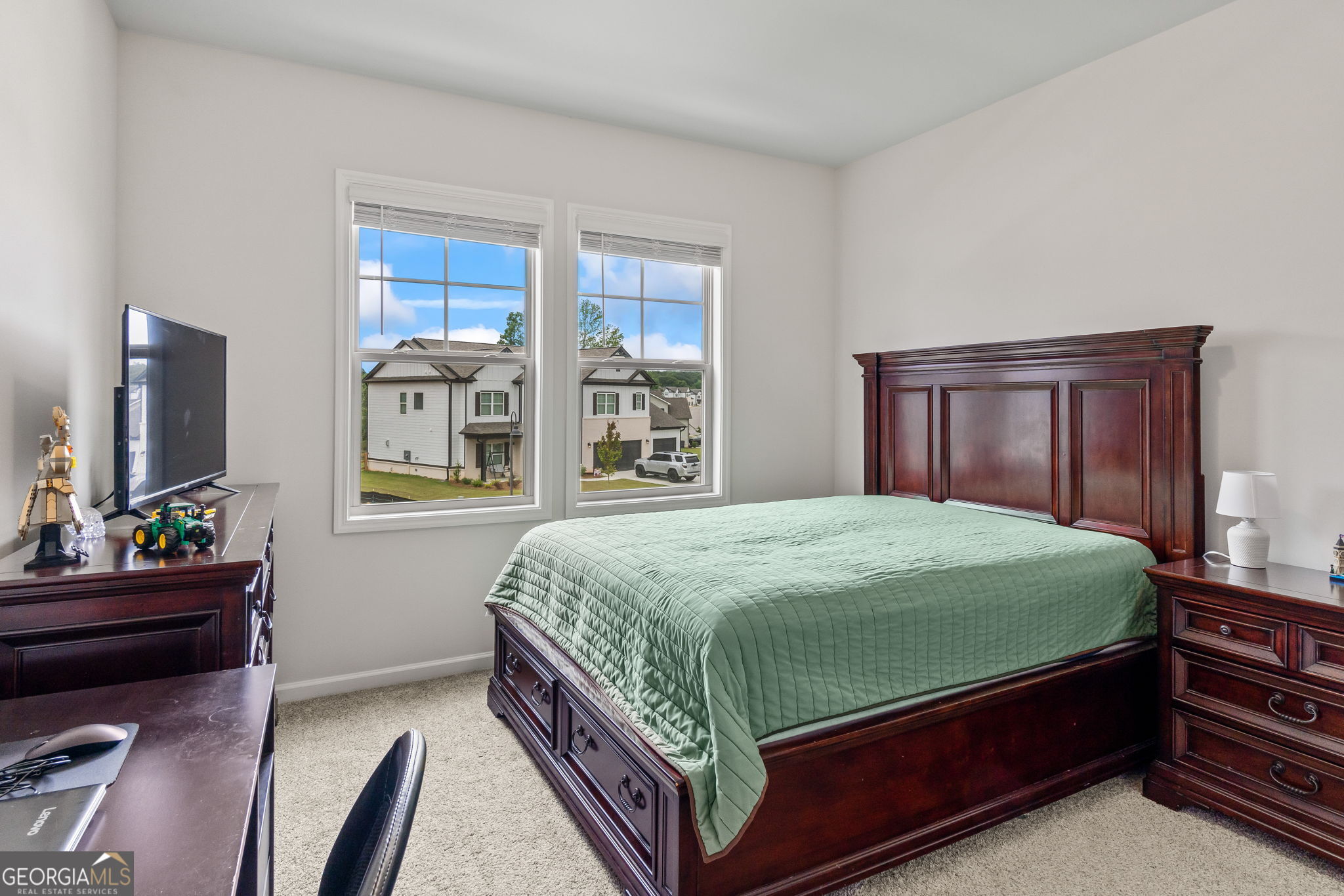 2884 Porches Lane Dacula, GA 30019 - Photo 23 of 41 a bedroom with a bed and window