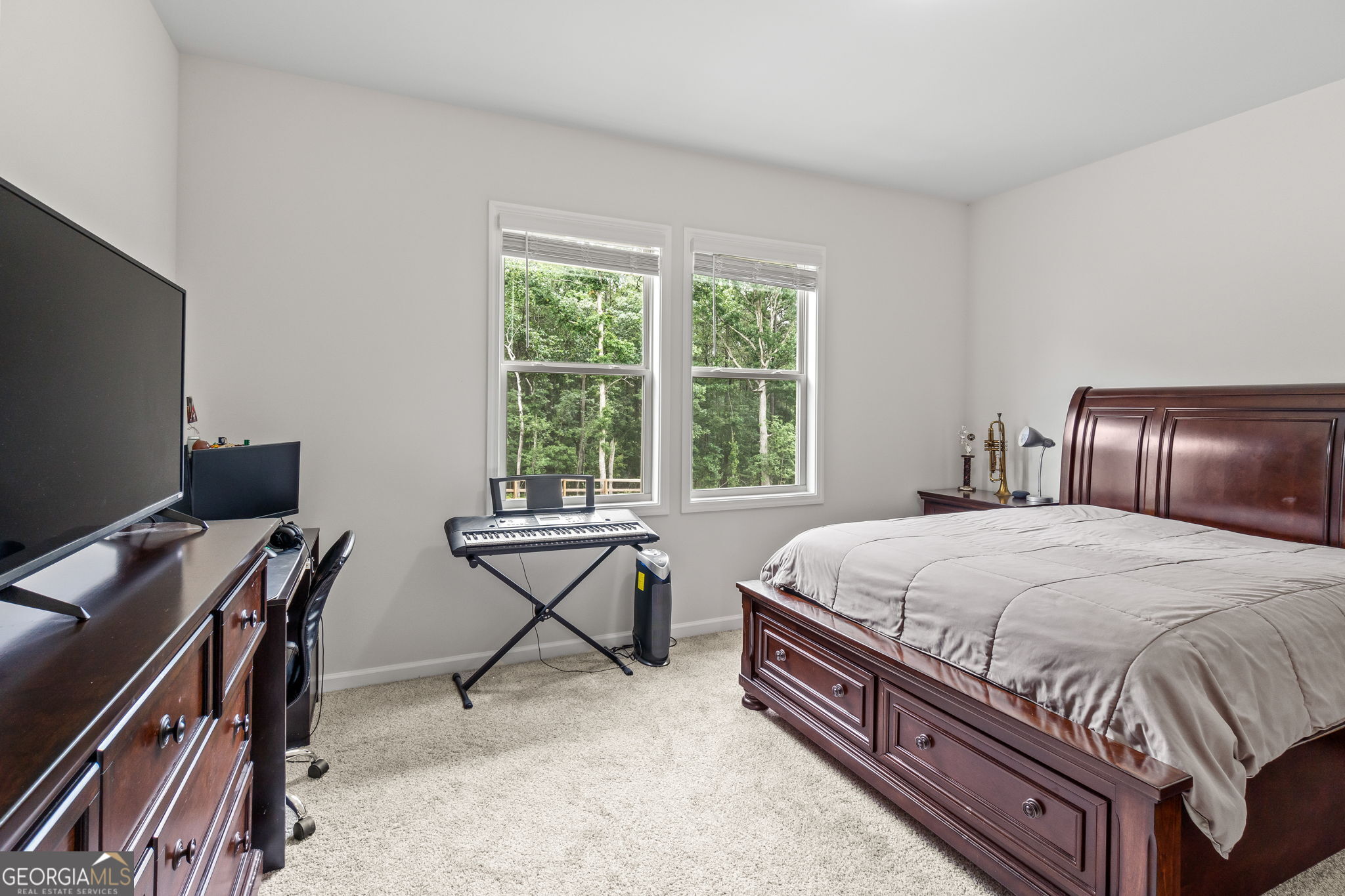 2884 Porches Lane Dacula, GA 30019 - Photo 29 of 41 a bedroom with a bed and a desk