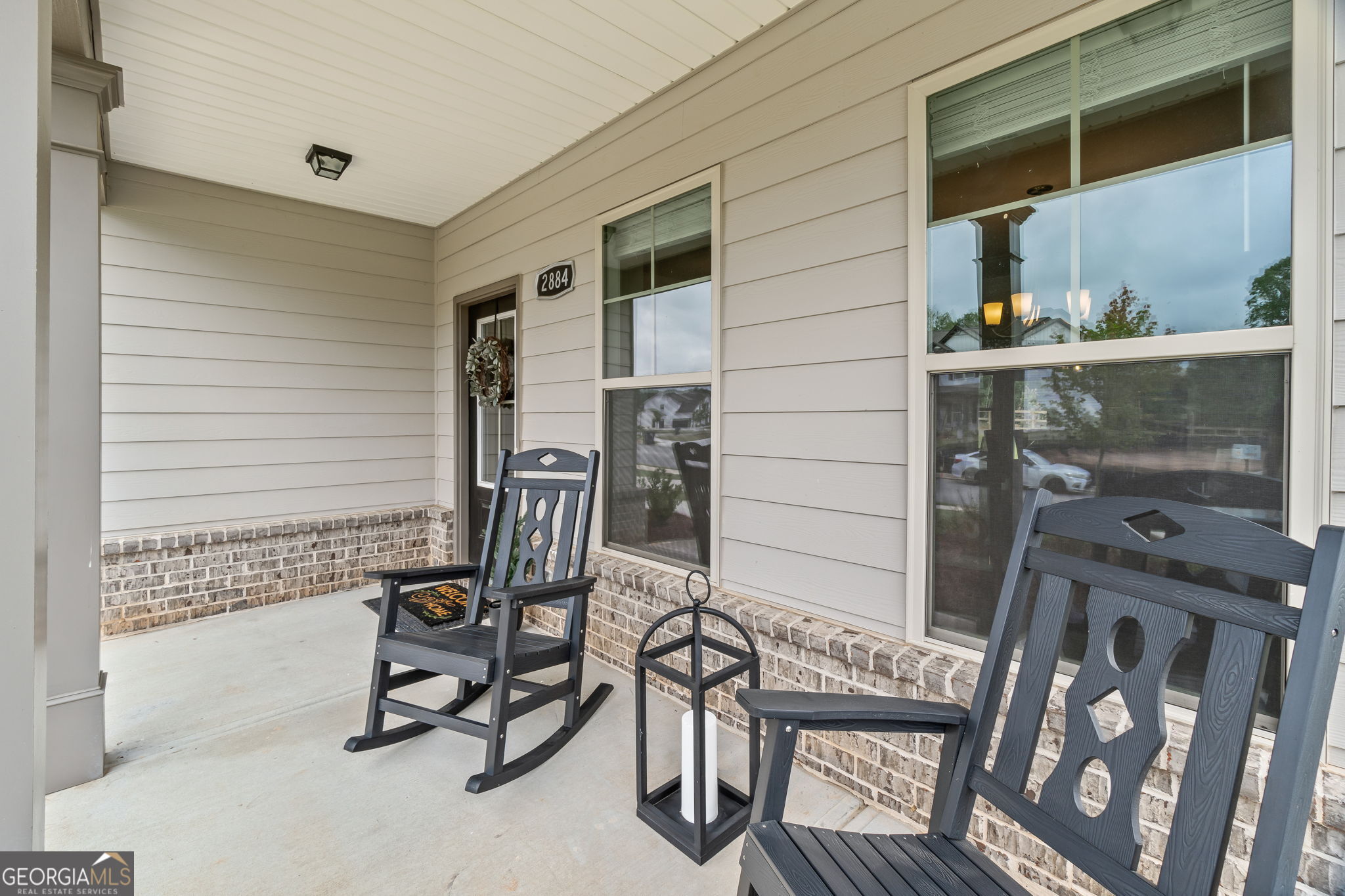 2884 Porches Lane Dacula, GA 30019 - Photo 3 of 41 a balcony with table and chairs