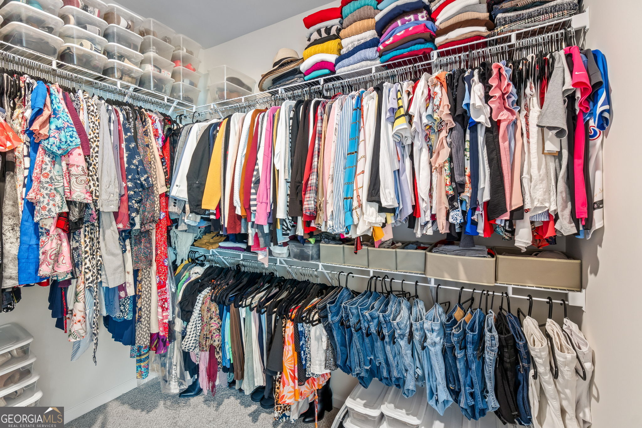 2884 Porches Lane Dacula, GA 30019 - Photo 35 of 41 a view of walk in closet with clothes