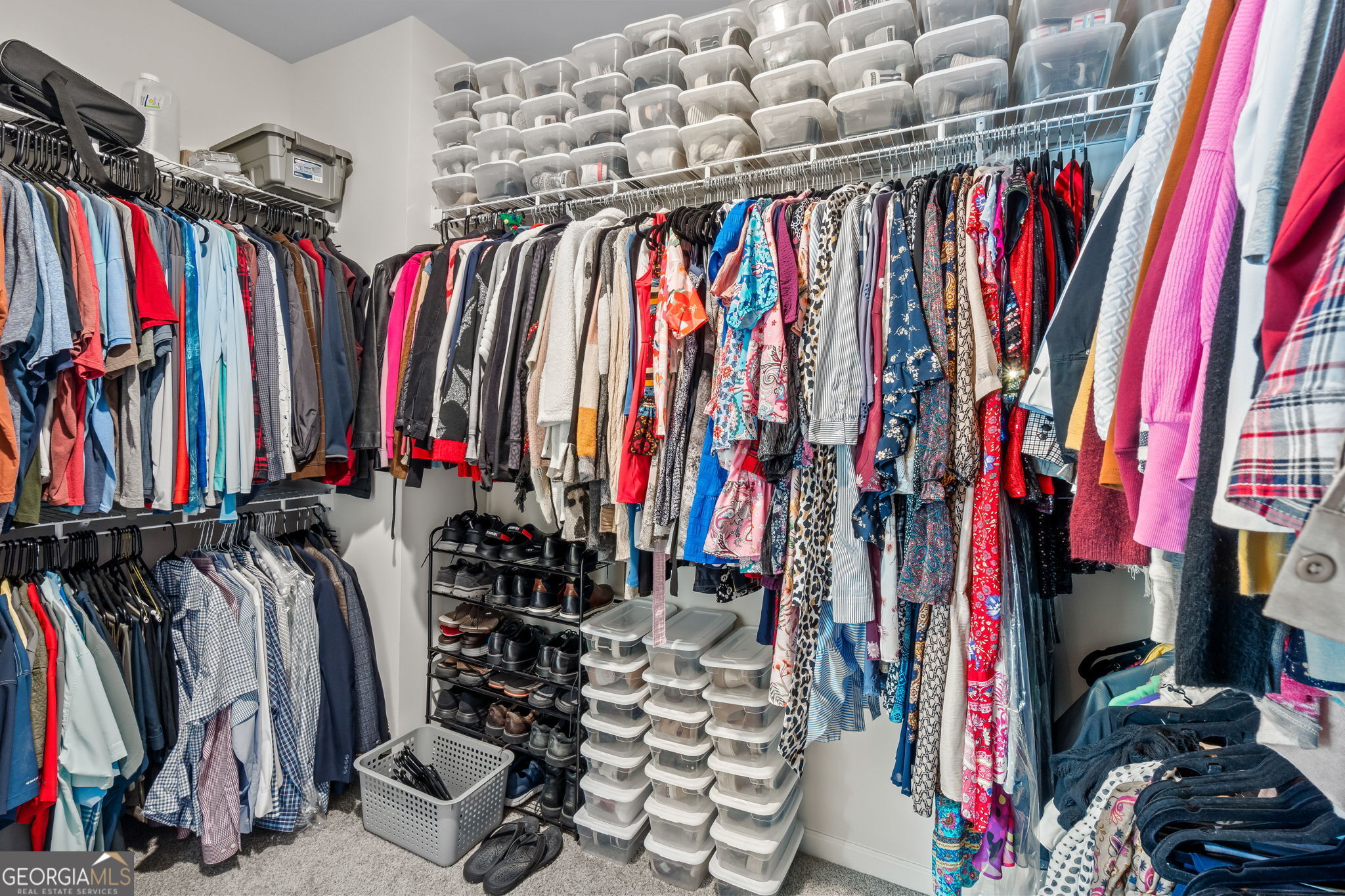 2884 Porches Lane Dacula, GA 30019 - Photo 36 of 41 a view of walk in closet with clothes