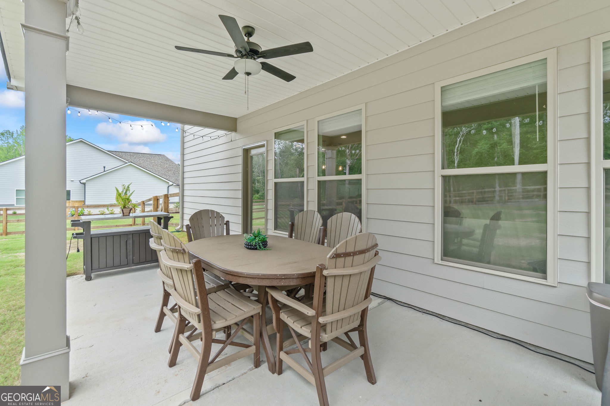 2884 Porches Lane Dacula, GA 30019 - Photo 37 of 41 a view of a dining room with furniture and a window