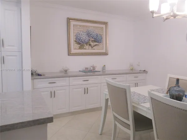 a kitchen with a sink cabinets and appliances