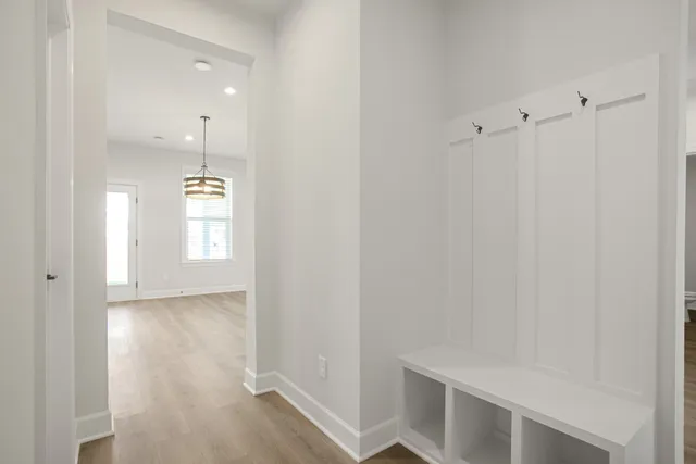 a view of an empty room and wooden floor