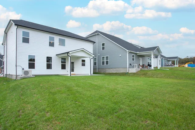 a view of a house with backyard