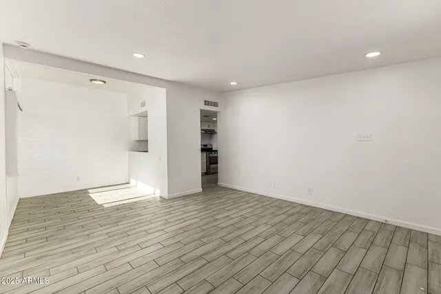 a view of an empty room and a window