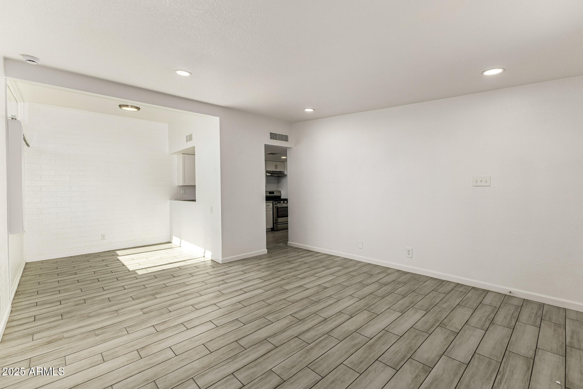 6708 East Cheery Lynn Road, Unit B Scottsdale, AZ 85251 - Photo 13 of 35 a view of an empty room with wooden floor and closet