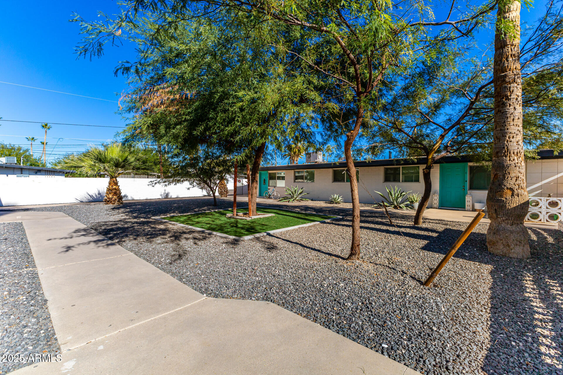 6708 East Cheery Lynn Road, Unit B Scottsdale, AZ 85251 - Photo 2 of 35 a backyard of a house with table and chairs