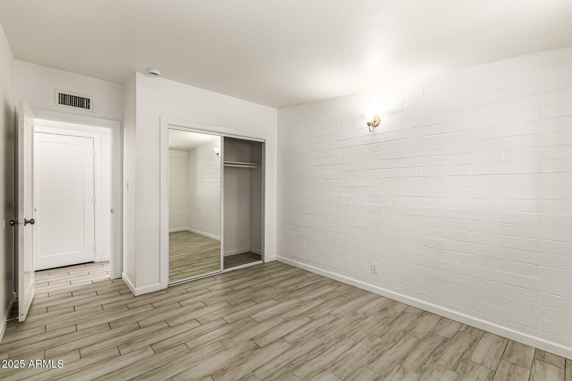 6708 East Cheery Lynn Road, Unit B Scottsdale, AZ 85251 - Photo 26 of 35 wooden floor in an empty room