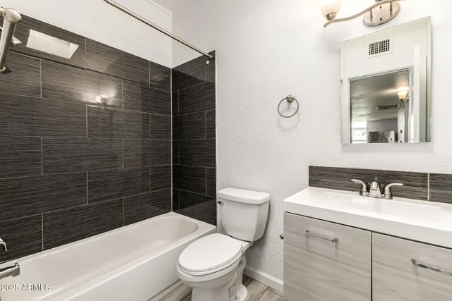 a bathroom with a sink and toilet