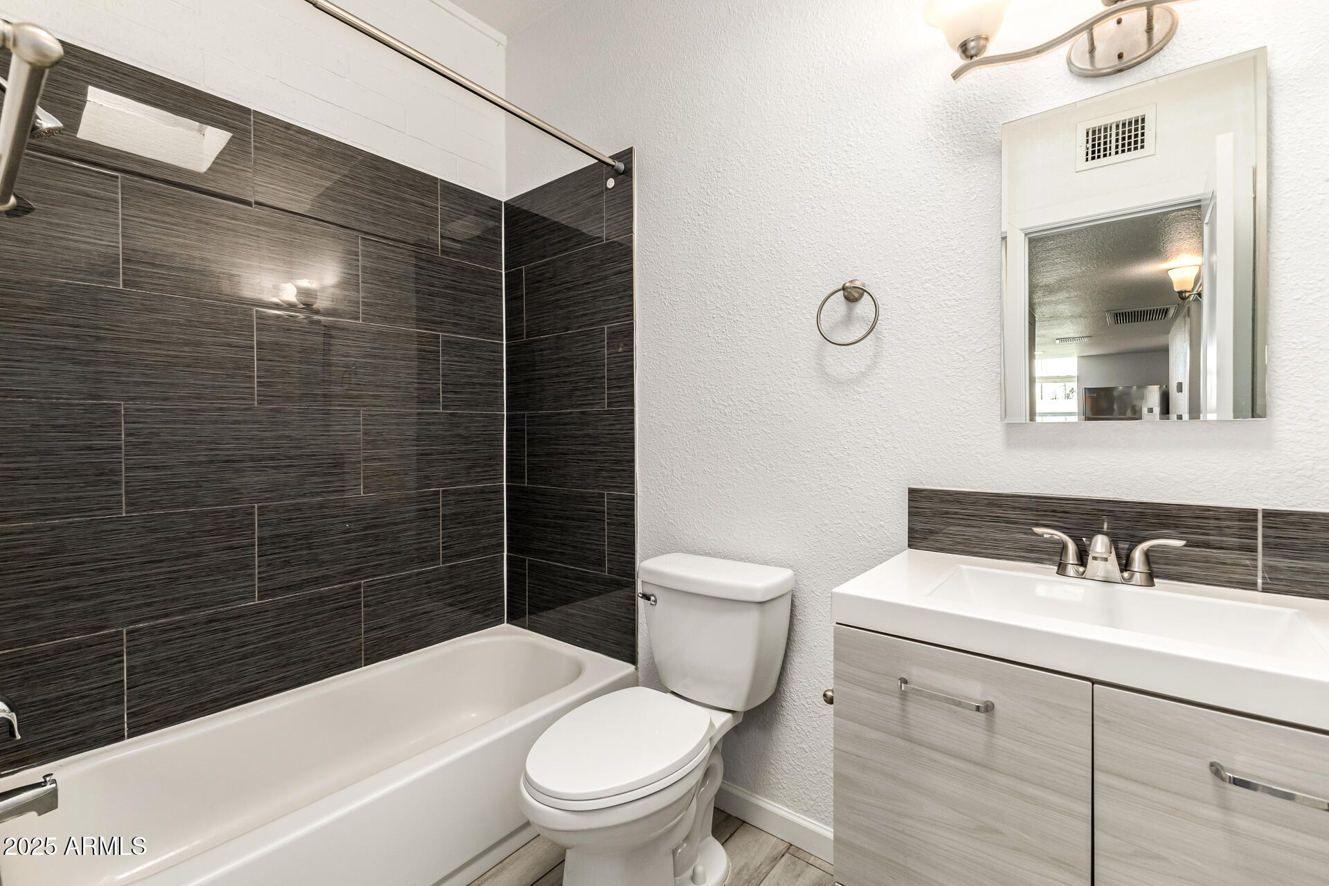 6708 East Cheery Lynn Road, Unit B Scottsdale, AZ 85251 - Photo 28 of 35 a bathroom with a sink a toilet and shower